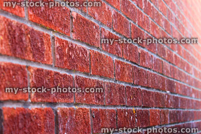 Stock image of modern red brick wall of house, looking sideways