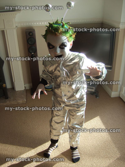 Stock image of boy in fancy dress monster / alien costume, face painting