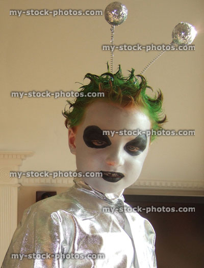 Stock image of boy in fancy dress monster / alien costume, face paint