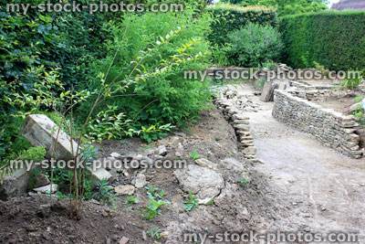 Stock image of sunken garden under construction / raised beds being built