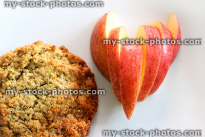 Stock image of snack food, cookie biscuit with heart shaped apple slices