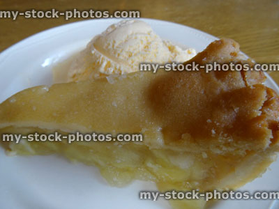 Stock image of homemade Bramley apple pie / ice cream dessert, apple tart slice