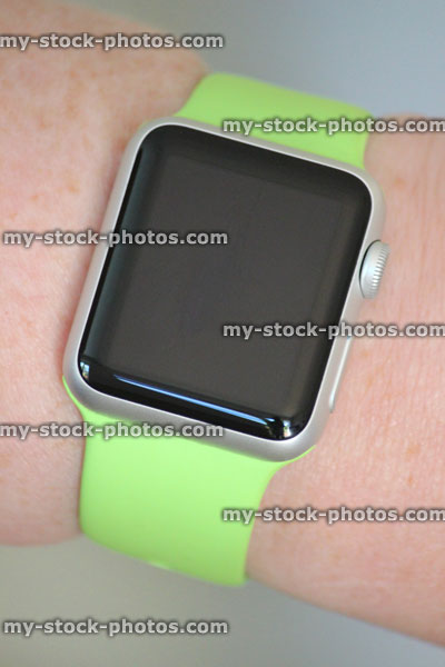 Stock image of Apple Watch Sport model, lime green strap, blank watch face