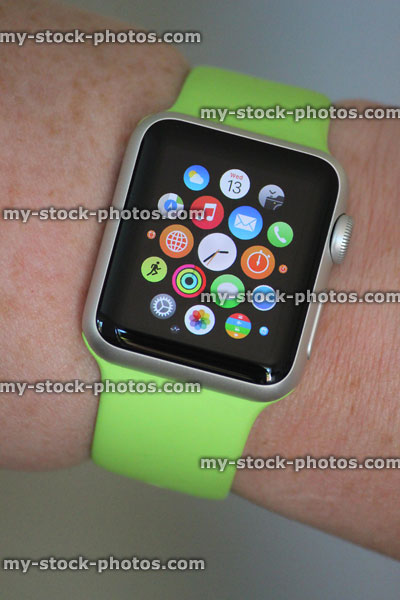 Stock image of Apple Watch Sport model, apps screen with clock