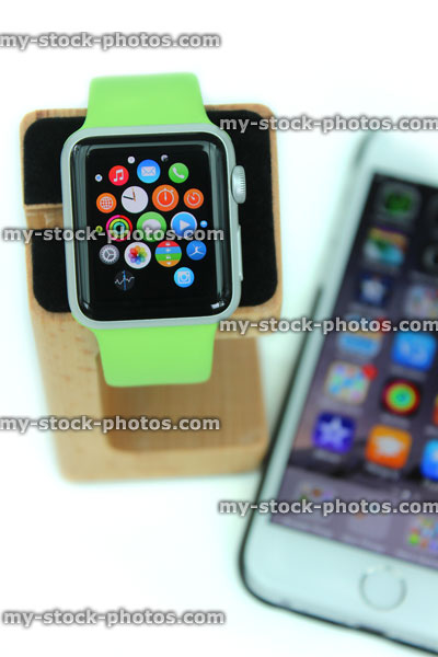 Stock image of Apple Watch on stand paired with iPhone 6