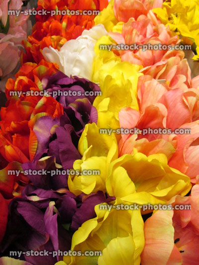Stock image of artificial plastic / silk tulips / tulip flowers (red, yellow, pink, purple)