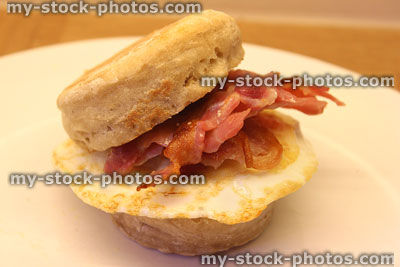 Stock image of homemade English muffin with crispy bacon and fried-egg