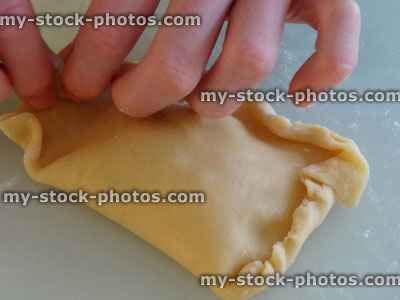 Stock image of homebaking, apple turnovers, butter puff pastry / pies / pasties, crimping edges