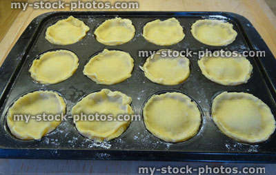 Stock image of home baking, individual apple pies / mince tarts, homemade shortcrust pastry tray
