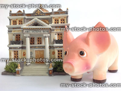 Stock image of model bank and a piggy bank