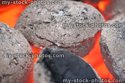 Stock image of hot charcoal briquettes on barbecue, BBQ hot coals
