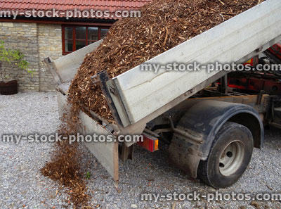 Stock image of bark mulch wood chips on van, unloaded / garden landscaping project