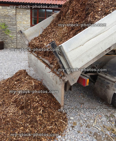 Stock image of bark mulch wood chips on van, unloaded / garden landscaping project
