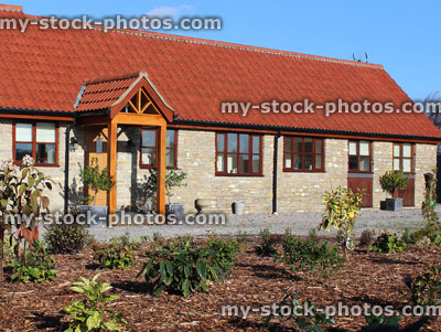 Stock image of old barn conversion house / bungalow, converted stables / outbuilding