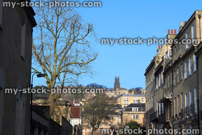 Stock image of historic, terraced Bath stone Georgian town houses, blue sky