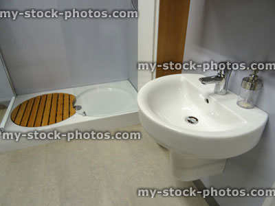 Stock image of modern bathroom, white wall hung sink / basin, shower tray