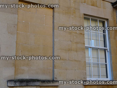 Stock image of blocked up window on historic Georgian house, window tax