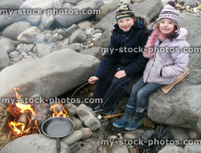 Stock image of children cooking on bonfire at Lyme Regis beach