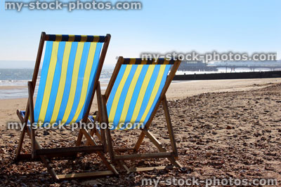 Stock image of photo of deck chairs in the sunshine on English beach
