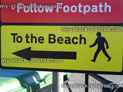 Stock image of seaside sign saying 'Follow Footpath to the Beach'