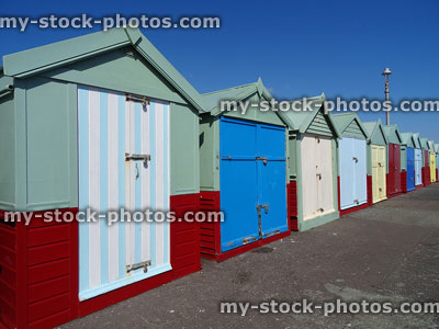 Stock image of row of colourful Brighton beach huts with painted doors