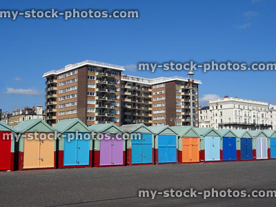 Stock image of colourful painted beach huts on Brighton seafront promenade