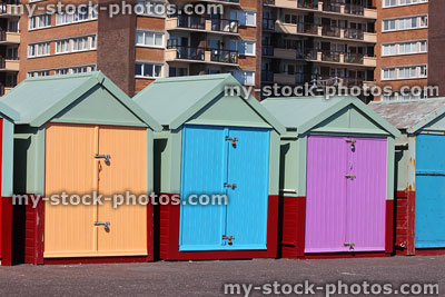 Stock image of beach huts in row on Brighton seaside promenade