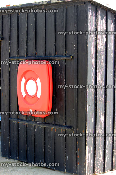 Stock image of red containerised ring buoy / lifebuoy lifering buoyancy aid