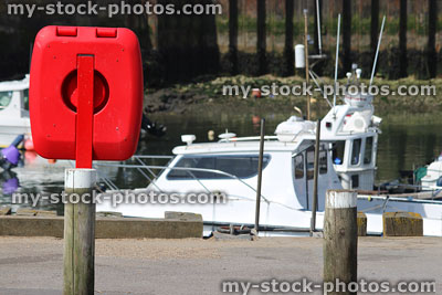 Stock image of lifering life preserver buoyancy aid donut by marina boats