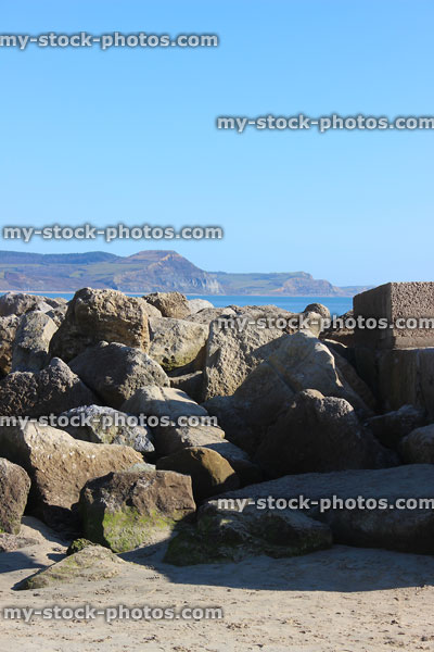 Stock image of pile of rocks, natural sea defence, beach rock armour