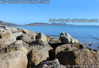 Stock image of coastal erosion management, riprap rock armour beach defence