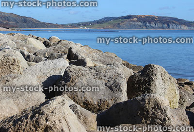 Stock image of limestone pile on beach, rock armour sea defence