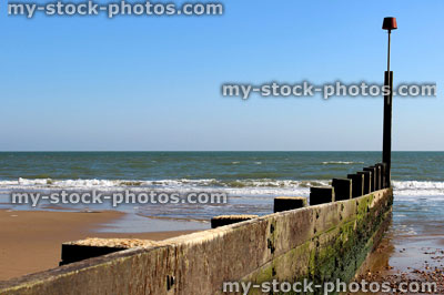 Stock image of looking down groyne on sandy beach in Dorset, England