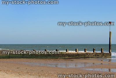 Stock image of an old wooden groyne preventing erosion of beach