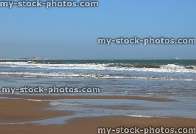 Stock image of sandy beach and sea at Bournemouth, Dorset, England