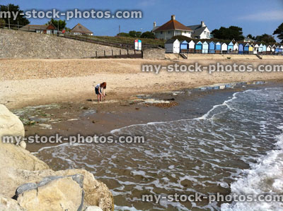 Stock image of young girl at beach playing in the sea