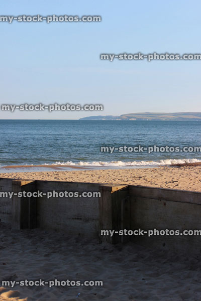 Stock image of wooden seaside groyne on sandy beach, sea erosion