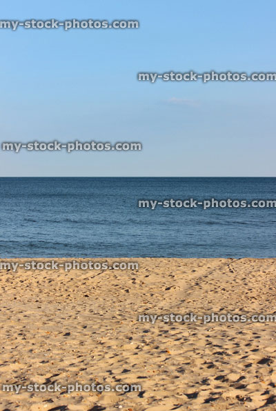 Stock image of sandy beach, sea and blue sky, seaside banner / summer holiday