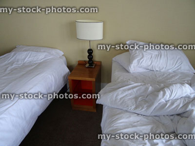 Stock image of unmade / made bed sheets, messy / tidy twin bedroom