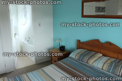 Stock image of colour coordinated bedroom suite with pine bed furniture