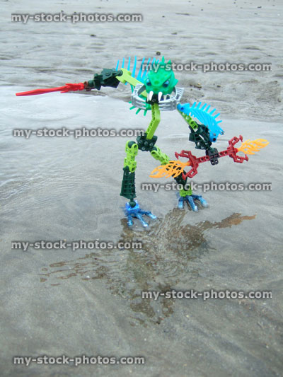 Stock image of strange alien monster figure on a beach