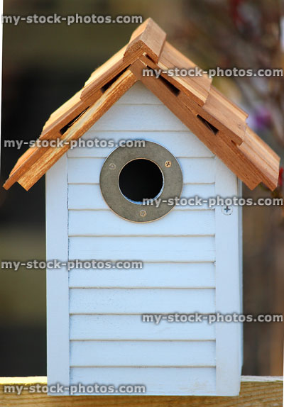 Stock image of blue wooden bird box / nesting box, like beach-hut