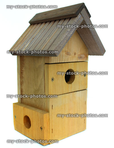 Stock image of wooden nesting box for small birds, spare entrance-hole