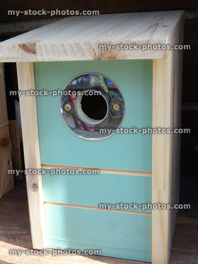 Stock image of wild bird nestbox / nesting box with metal entrance-hole