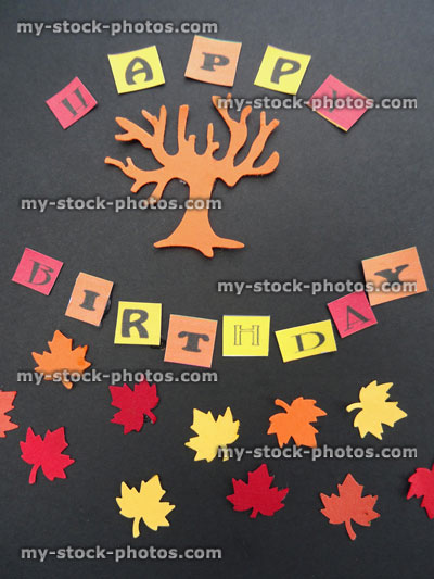 Stock image of homemade Happy Birthday greetings card, paper autumn leaves