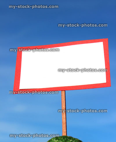 Stock image of small toy blank white sign / model signpost / miniature placard banner