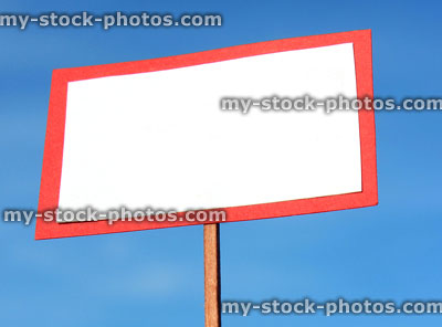 Stock image of small toy blank white sign / model signpost / miniature placard banner