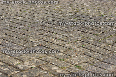 Stock image of block paved drive with bricks laid in herringbone pattern