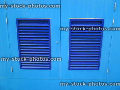 Stock image of royal blue louvre doors / shutters, turquoise wooden cupboard doors