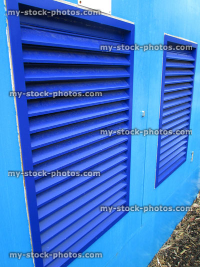 Stock image of royal blue louvre doors / shutters, turquoise wooden cupboard doors